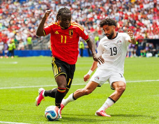 SEATTLE, WASHINGTON - JUNE 15: JÃ rÃ my Doku of Belgium battles for the ball with Marwan Attia of Egypt during the FIFA World Cup, WM, Weltmeisterschaft, Fussball 2026 Group G match between Belgium and Egypt at Seattle Stadium on June 15, 2026 in Seattle, Washington.  Copyright: xMBxMediax