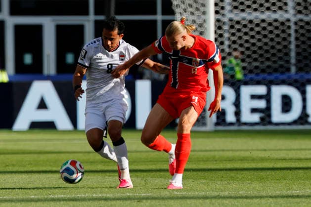 Norway forward Erling Haaland right and Iraq midfielder Ibrahim Bayesh in action during the first half of their FIFA World Cup, WM, Weltmeisterschaft, Fussball match at Gillette Stadium in Foxborough, Massachusetts, on Tuesday, June 16, 2026.  BOP20260616011 CJxGUNTHER