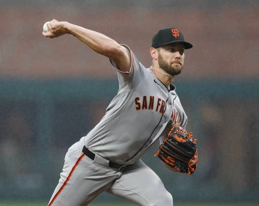 Pitcher Adrian Houser 12 of the San Francisco Giants throws a pitch in the first inning against the Atlanta Braves at Truist Park on Tuesday, June 16, 2026 in Atlanta, Georgia.  ATL20260616104 MikexZarrilli