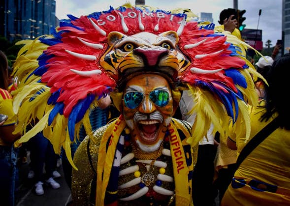 Colombian Fans Gather At Angel Of Independence Ahead Of Colombia™s World Cup Debut A Colombia supporter wearing a colorful feathered headdress, face paint, and sunglasses poses during a gathering of Colombian fans at the Angel of Independence in Mexico City, Mexico, on June 16, 2026. Thousands of Colombian supporters living in Mexico and traveling fans gather at the iconic monument to celebrate and show their support for the national team, Nationalteam ahead of Colombia s debut match at the FIFA World Cup, WM, Weltmeisterschaft, Fussball 2026. Mexico City Mexico  Copyright: xRafaelxRodriguezx originalFilename:rodriguez-notitle260616_npJDu.jpg