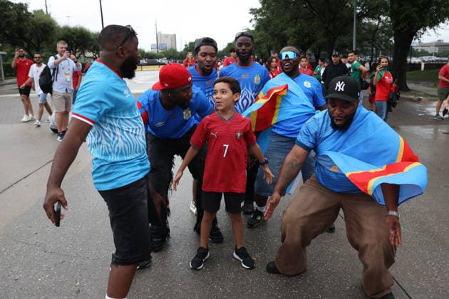 FIFA World Cup, WM, Weltmeisterschaft, Fussball 2026 - Group K - Portugal vs DR Congo DR Congo fans and a young fan of Portugal pose for photographs prior to the FIFA World Cup 2026 group stage match between Portugal and DR Congo, in Houston, Texas, USA, 17 June 2026. Houston United States  Copyright: xMIGUELxA.xLOPESx
