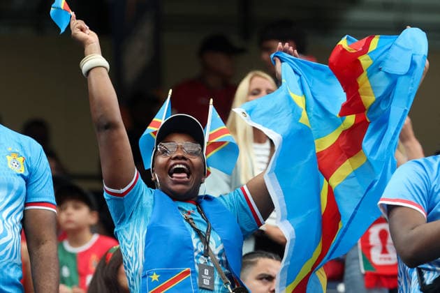 HOUSTON, TX - JUNE 17: A Congo Dr fan waives her country™s flags ahead of the FIFA World Cup, WM, Weltmeisterschaft, Fussball 2026 Group K match between Portugal and Congo DR on June 17, 2026, at Houston Stadium in Houston, Texas. (Photo by David Buono Icon Sportswire) SOCCER: JUN 17 FIFA World Cup 26 Group K - Portugal vs Congo DR EDITORIAL USE ONLY Icon260617001