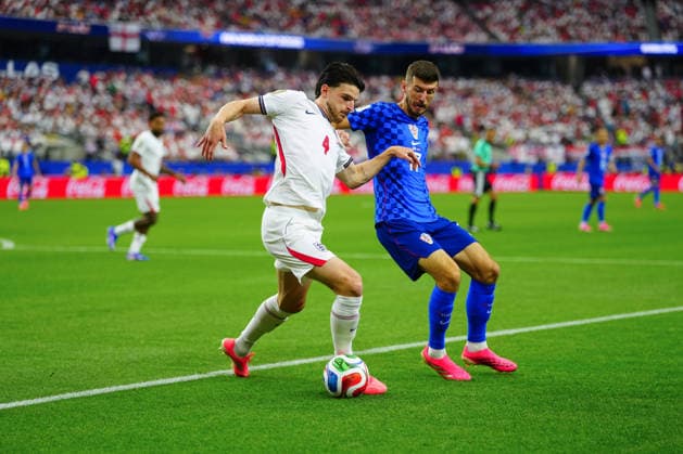 Declan Rice of England and Petar Sucic of Croatia England v Croatia, 2026 FIFA World Cup, WM, Weltmeisterschaft, Fussball Group L, Football, Dallas Stadium, Arlington, Texas, USA - 17 Jun 2026Arlington Dallas Stadium Texas (TX) United States of America EDITORIAL USE ONLY No use with unauthorised audio, video, data, fixture lists, club league logos or live services. Online in-match use limited to 120 images, no video emulation. No use in betting, games or single club league player publications.  Copyright: xJavierxGarcia Shutterstockx 16928920ar