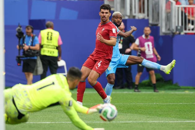 HOUSTON, TX - JUNE 17: Cedric Bakambu 17 of DR Congo watches his shot on goal get saved by Diego Costa 1 of Portugal while being defended by Tomas Araujo 4 of Portugal during the FIFA World Cup, WM, Weltmeisterschaft, Fussball 2026 Group K match between Portugal and Congo DR on June 17, 2026, at Houston Stadium in Houston, Texas. (Photo by David Buono Icon Sportswire) SOCCER: JUN 17 FIFA World Cup 26 Group K - Portugal vs Congo DR EDITORIAL USE ONLY Icon260617038