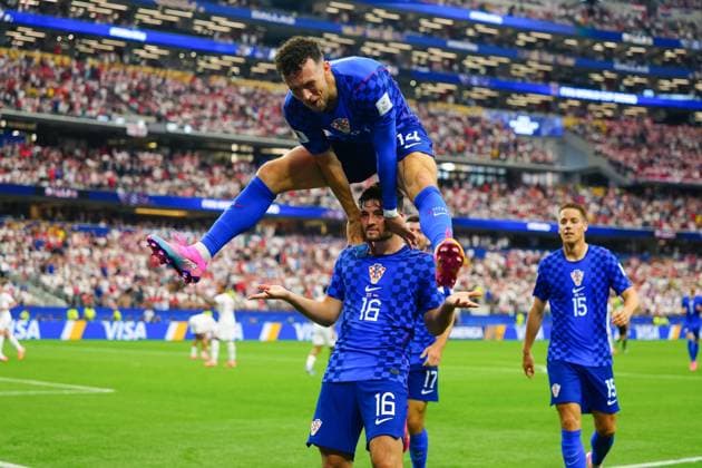 Martin Baturina celebrates scoring for Croatia with Ivan Perisic leaping over his shoulders England v Croatia, 2026 FIFA World Cup, WM, Weltmeisterschaft, Fussball Group L, Football, Dallas Stadium, Arlington, Texas, USA - 17 Jun 2026Arlington Dallas Stadium Texas (TX) United States of America EDITORIAL USE ONLY No use with unauthorised audio, video, data, fixture lists, club league logos or live services. Online in-match use limited to 120 images, no video emulation. No use in betting, games or single club league player publications.  Copyright: xJavierxGarcia Shutterstockx 16928920bn