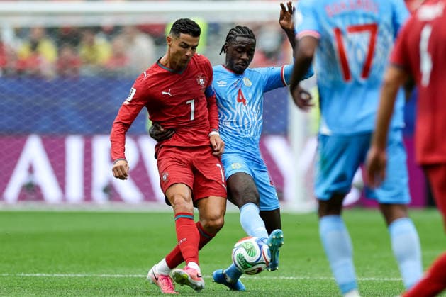 Portugal s Cristiano Ronaldo and DR Congo s Axel Tuanzebe battling for the ball during the FIFA World Cup, WM, Weltmeisterschaft, Fussball 2026 Group K match between Portugal and Congo DR at Houston Stadium on June 17, 2026 in Houston, United States. (Photo by Torbjorn Tande DeFodi Images) - *** Portugals Cristiano Ronaldo and DR Congos Axel Tuanzebe battling for the ball during the 2026 FIFA World Cup Group K match between Portugal and DR Congo at Houston Stadium on June 17, 2026, in Houston, United States. Photo by Torbjorn Tande, DeFodi Images,detected_source_language