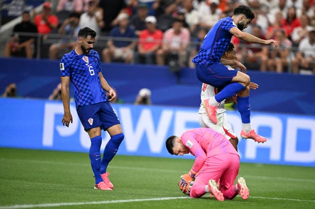 (260618) -- DALLAS, June 18, 2026 -- Dominik Livakovic, goalkeeper of Croatia, saves a goal during the group L match between England and Croatia at the 2026 FIFA World Cup, WM, Weltmeisterschaft, Fussball at the Dallas Stadium in Dallas, the United States, on June 17, 2026. ) (SP)U.S.-DALLAS-FOOTBALL-FIFA WORLD CUP-GROUP L-ENG VS CRO WuxXiaoling 
