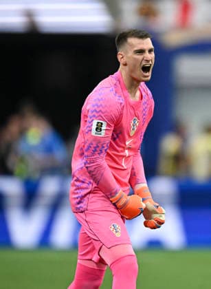 (260618) -- DALLAS, June 18, 2026 -- Dominik Livakovic, goalkeeper of Croatia, celebrates their first goal during the group L match between England and Croatia at the 2026 FIFA World Cup, WM, Weltmeisterschaft, Fussball at the Dallas Stadium in Dallas, the United States, on June 17, 2026. ) (SP)U.S.-DALLAS-FOOTBALL-FIFA WORLD CUP-GROUP L-ENG VS CRO WuxXiaoling 