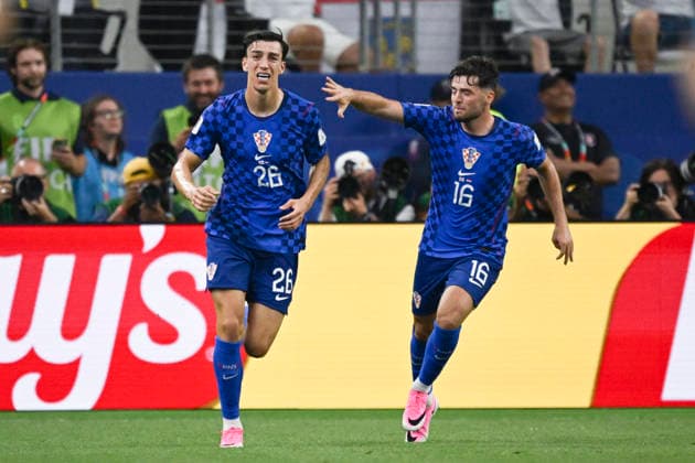 (260618) -- DALLAS, June 18, 2026 -- Petar Musa (L) and Martin Baturina of Croatia celebrate scoring during the group L match between England and Croatia at the 2026 FIFA World Cup, WM, Weltmeisterschaft, Fussball at the Dallas Stadium in Dallas, the United States, on June 17, 2026. ) (SP)U.S.-DALLAS-FOOTBALL-FIFA WORLD CUP-GROUP L-ENG VS CRO WuxXiaoling 