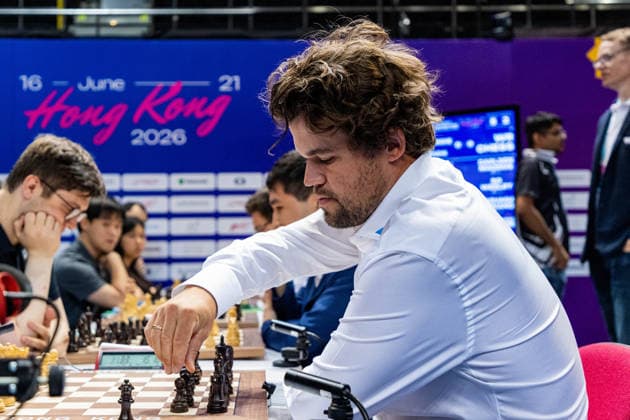 June 18, 2026, Hong Kong, Hong Kong, China: Chess Grandmaster MAGNUS CARLSEN (NOR) fixes his chess pieces during a Rapid match at the 2026 FIDE World Team Rapid and Blitz Chess Championship in Hong Kong. Hong Kong China - ZUMAm298 0859442622st Copyright: xJamesxModestox