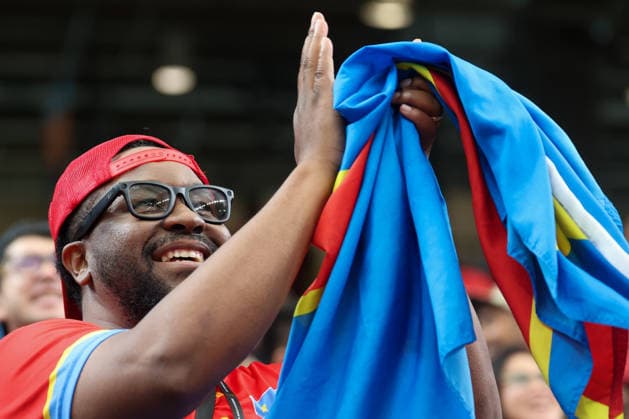HOUSTON, TX - JUNE 17: A Congo DR fan holds his county™s flag and wears his Ray-Ban Meta glasses ahead of the FIFA World Cup, WM, Weltmeisterschaft, Fussball 2026 Group K match between Portugal and Congo DR on June 17, 2026, at Houston Stadium in Houston, Texas. (Photo by David Buono Icon Sportswire) SOCCER: JUN 17 FIFA World Cup 26 Group K - Portugal vs Congo DR EDITORIAL USE ONLY Icon260617076