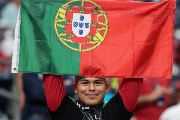 HOUSTON, TX - JUNE 17: A Portugal fan holds his country™s flag over his head ahead of the FIFA World Cup, WM, Weltmeisterschaft, Fussball 2026 Group K match between Portugal and Congo DR on June 17, 2026, at Houston Stadium in Houston, Texas. (Photo by David Buono Icon Sportswire) SOCCER: JUN 17 FIFA World Cup 26 Group K - Portugal vs Congo DR EDITORIAL USE ONLY Icon260617078
