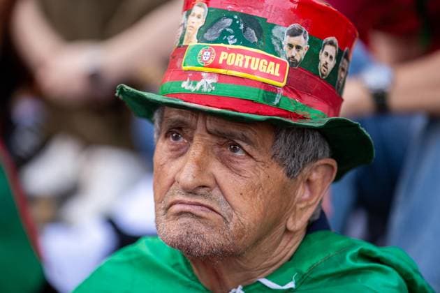 June 17, 2026, Porto, Portugal: A Portugal supporter wearing a decorated hat and team colours watches the Portugal vs DR Congo World Cup match at the Fan Zone in Praca D. Joao I. World Cup Fan Zone, Portugal Vs DR Congo In Porto, Portugal - 17 Jun 2026  - ZUMAs197 20260617_aaa_s197_749 Copyright: xDiogoxBaptistax