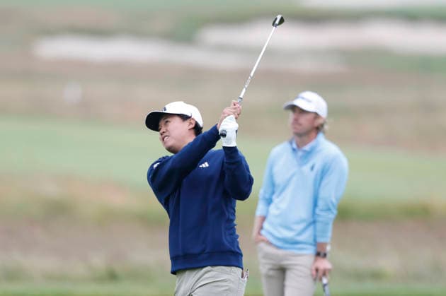 Brandon Wu hits an approach shot to the 1st green during the first round of the 126th U.S. Open Golf Championship at Shinnecock Hills Golf Club in Southampton, NY, on Thursday, June 18, 2026.  NYC20260618804 JOHNxANGELILLO