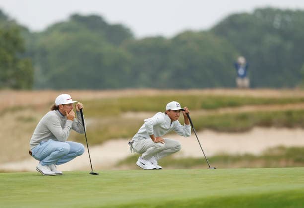 Cameron Smith of Australia and amateur Miles Russell line up their putts on the 1st green during the first round of the 126th U.S. Open Golf Championship at Shinnecock Hills Golf Club in Southampton, NY, on Thursday, June 18, 2026.  NYC20260618811 JOHNxANGELILLO