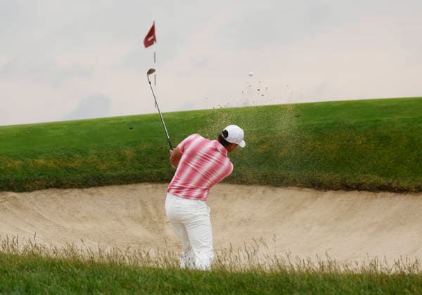 Brooks Koepka hits out of a bunker on the 1st hole during the first round of the 126th U.S. Open Golf Championship at Shinnecock Hills Golf Club in Southampton, NY, on Thursday, June 18, 2026.  NYC20260618816 JOHNxANGELILLO