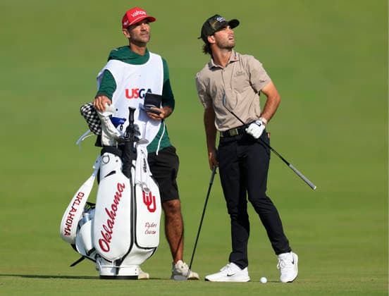Amateur Ryder Cowan talks with his caddie on the 1st fairway during the first round of the 126th U.S. Open Golf Championship at Shinnecock Hills Golf Club in Southampton, NY, on Thursday, June 18, 2026.  NYC20260618905 COREYxSIPKIN