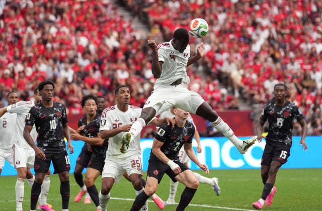(260619) --VANCOUVER, June 19, 2026 -- Issa Laye (top) of Qatar fights for a head ball during a group B match between Canada and Qatar at the 2026 FIFA World Cup, WM, Weltmeisterschaft, Fussball at BC Place Vancouver in Vancouver, Canada, June 18, 2026. ) (SP)CANADA-VANCOUVER-FOOTBALL-FIFA WORLD CUP-GROUP B-CAN VS QAT MengxYongmin 