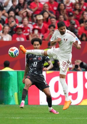 (260619) -- VANCOUVER, June 19, 2026 -- Tajon Buchanan (L) of Canada vies with Sultan Albrake of Qatar during the group B match between Canada and Qatar at the 2026 FIFA World Cup, WM, Weltmeisterschaft, Fussball at BC Place Vancouver in Vancouver, Canada, June 18, 2026. ) (SP)CANADA-VANCOUVER-FOOTBALL-FIFA WORLD CUP-GROUP B-CAN VS QAT MengxYongmin 