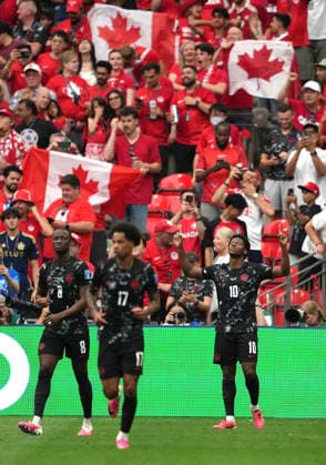 (260619) -- VANCOUVER, June 19, 2026 -- Jonathan David (R) of Canada celebrates his goal during the group B match between Canada and Qatar at the 2026 FIFA World Cup, WM, Weltmeisterschaft, Fussball at BC Place Vancouver in Vancouver, Canada, June 18, 2026. ) (SP)CANADA-VANCOUVER-FOOTBALL-FIFA WORLD CUP-GROUP B-CAN VS QAT MengxYongmin 