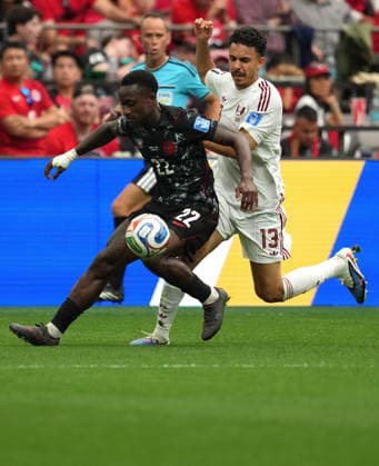 (260619) -- VANCOUVER, June 19, 2026 -- Richie Laryea (L) of Canada vies with Ayoub Aloui of Qatar during the group B match between Canada and Qatar at the 2026 FIFA World Cup, WM, Weltmeisterschaft, Fussball at BC Place Vancouver in Vancouver, Canada, June 18, 2026. ) (SP)CANADA-VANCOUVER-FOOTBALL-FIFA WORLD CUP-GROUP B-CAN VS QAT MengxYongmin 