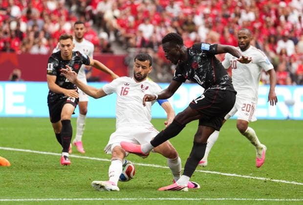 (260619) -- VANCOUVER, June 19, 2026 -- Tani Oluwaseyi (R, front) of Canada shoots during the group B match between Canada and Qatar at the 2026 FIFA World Cup, WM, Weltmeisterschaft, Fussball at BC Place Vancouver in Vancouver, Canada, June 18, 2026. ) (SP)CANADA-VANCOUVER-FOOTBALL-FIFA WORLD CUP-GROUP B-CAN VS QAT MengxYongmin 