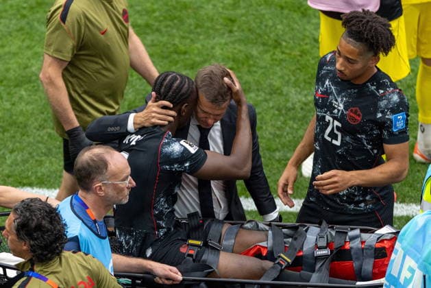 June 18, 2026, Vancouver, Bc, CANADA: Canada s Ismael Kone (8) embraces manager Jesse Marsch while going off on a stretcher during second half group B World Cup soccer action against Qatar, in Vancouver, on Thursday, June 18, 2026. Canada News - June 18, 2026  - ZUMAc35_ 20260618_zaf_c35_419 Copyright: xTimothyxMatweyx