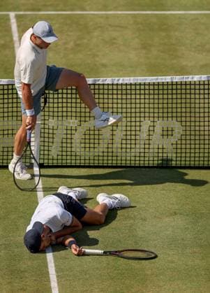Francisco Cerundolo of Argentina lies on the grass clutching his throat having been hit by Arthur Fery of GB HSBC Queen s Club Championships, Day Fourteen, Tennis, Queen s Club, West Kensington, London, UK - 19 Jun 2026London Queen s Club United Kingdom  Copyright: xEllaxLing Shutterstockx 16929306ar