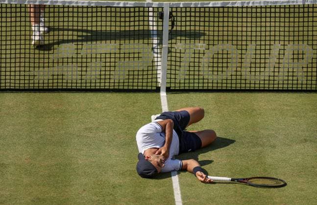 Francisco Cerundolo of Argentina lies on the grass clutching his throat having been hit by Arthur Fery of GB HSBC Queen s Club Championships, Day Fourteen, Tennis, Queen s Club, West Kensington, London, UK - 19 Jun 2026London Queen s Club United Kingdom  Copyright: xEllaxLing Shutterstockx 16929306at