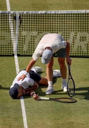 Francisco Cerundolo of Argentina lies on the grass clutching his throat having been hit by Arthur Fery of GB HSBC Queen s Club Championships, Day Fourteen, Tennis, Queen s Club, West Kensington, London, UK - 19 Jun 2026London Queen s Club United Kingdom  Copyright: xEllaxLing Shutterstockx 16929306an