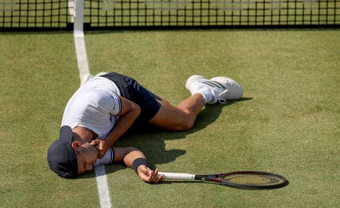 Francisco Cerundolo of Argentina lies on the grass clutching his throat having been hit by Arthur Fery of GB HSBC Queen s Club Championships, Day Fourteen, Tennis, Queen s Club, West Kensington, London, UK - 19 Jun 2026London Queen s Club United Kingdom  Copyright: xEllaxLing Shutterstockx 16929306aq