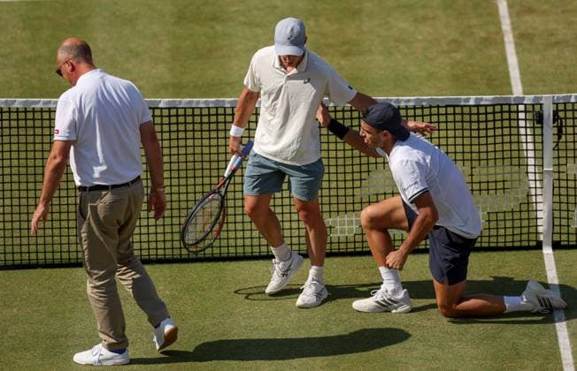 Francisco Cerundolo of Argentina lies on the grass clutching his throat having been hit by Arthur Fery of GB HSBC Queen s Club Championships, Day Fourteen, Tennis, Queen s Club, West Kensington, London, UK - 19 Jun 2026London Queen s Club United Kingdom  Copyright: xEllaxLing Shutterstockx 16929306ah
