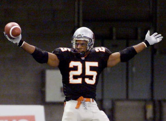 July 18, 2002, Vancouver, Bc, Canada: BC Lions Sean Millington (25) celebrates one of two touchdowns he scored in the second quarter of CFL action against the Hamilton Tiger-Cats in Vancouver Thursday, July 18, 2002. The Lions led 23-14 at the half. (CP PHOTO ) SEAN MILLINGTON  - ZUMAc35_ 20020718_zaf_c35_001 Copyright: xRichardxLamx