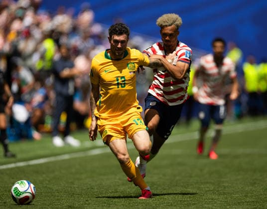 SEATTLE, WASHINGTON - JUNE 19: Antonee Robinson of United States battles for the ball with Aiden O Neill of Australia during the FIFA World Cup, WM, Weltmeisterschaft, Fussball 2026 Group D match between USA and Australia at Seattle Stadium on June 19, 2026 in Seattle, Washington.  Copyright: xMBxMediax
