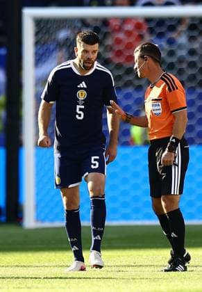 Grant Hanley of Scotland talking to the referee Scotland v Morocco, 2026 FIFA World Cup, WM, Weltmeisterschaft, Fussball Group C, Football, Boston Stadium, Foxborough, Massachusetts, USA - 19 Jun 2026Foxborough Boston Stadium Massachusetts (MA) United States of America EDITORIAL USE ONLY No use with unauthorised audio, video, data, fixture lists, club league logos or live services. Online in-match use limited to 120 images, no video emulation. No use in betting, games or single club league player publications.  Copyright: xMichaelxZemanek Shutterstockx 16928953as