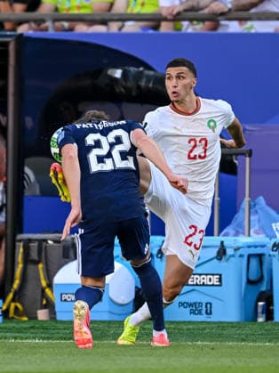 Nathan Patterson (Scotland) and Bilal El Khannouss (Morocco) battle for the ball during the FIFA World Cup, WM, Weltmeisterschaft, Fussball 2026 Group C match between Scotland and Morocco at Boston Stadium on June 19, 2026 in Boston, United States. (Photo by Harry Langer DeFodi Images) - *** Nathan Patterson of Scotland and Bilal El Khannouss of Morocco battle for the ball during the 2026 FIFA World Cup Group C match between Scotland and Morocco at Boston Stadium on June 19, 2026, in Boston, United States. Photo by Harry Langer, DeFodi Images,detected_source_language