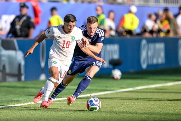 Brahim Diaz (Morocco) and Lewis Ferguson (Scotland) battle for the ball during the FIFA World Cup, WM, Weltmeisterschaft, Fussball 2026 Group C match between Scotland and Morocco at Boston Stadium on June 19, 2026 in Boston, United States. (Photo by Harry Langer DeFodi Images) - *** Brahim Diaz of Morocco and Lewis Ferguson of Scotland battle for the ball during the 2026 FIFA World Cup Group C match between Scotland and Morocco at Boston Stadium on June 19, 2026, in Boston, United States. Photo by Harry Langer, DeFodi Images,detected_source_language