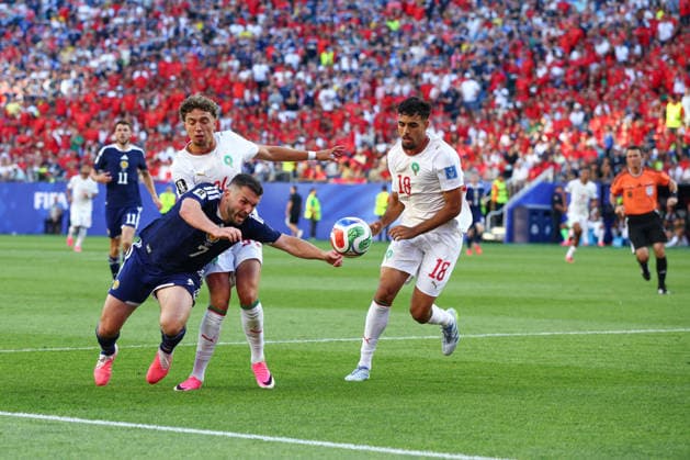 FIFA World Cup, WM, Weltmeisterschaft, Fussball 2026: Scotland v Morocco BOSTON, USA - 19th June 2026: John McGinn of Scotland goes down under the challenge of Neil El Aynaoui of Morocco and claims for a penalty during the FIFA World Cup 2026 Group C match between Scotland and Morocco at Boston Stadium Boston Boston Stadium United States of America Copyright: xCraigxMercerx xPeakxActionxPhotosx