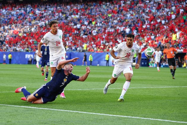 FIFA World Cup, WM, Weltmeisterschaft, Fussball 2026: Scotland v Morocco BOSTON, USA - 19th June 2026: John McGinn of Scotland goes down under the challenge of Neil El Aynaoui of Morocco and claims for a penalty during the FIFA World Cup 2026 Group C match between Scotland and Morocco at Boston Stadium Boston Boston Stadium United States of America Copyright: xCraigxMercerx xPeakxActionxPhotosx