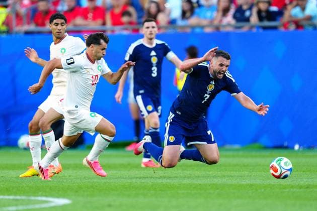 Brahim Diaz of Morocco and John McGinn of Scotland Scotland v Morocco, 2026 FIFA World Cup, WM, Weltmeisterschaft, Fussball Group C, Football, Boston Stadium, Foxborough, Massachusetts, USA - 19 Jun 2026Foxborough Boston Stadium Massachusetts (MA) United States of America EDITORIAL USE ONLY No use with unauthorised audio, video, data, fixture lists, club league logos or live services. Online in-match use limited to 120 images, no video emulation. No use in betting, games or single club league player publications.  Copyright: xJavierxGarcia Shutterstockx 16928932dm
