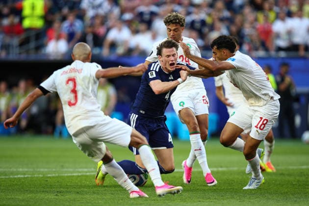 FIFA World Cup, WM, Weltmeisterschaft, Fussball 2026: Scotland v Morocco BOSTON, USA - 19th June 2026: Scott McTominay of Scotland goes down under the challenge of Neil El Aynaoui of Morocco and claims for a penalty during the FIFA World Cup 2026 Group C match between Scotland and Morocco at Boston Stadium Boston Boston Stadium United States of America Copyright: xCraigxMercerx xPeakxActionxPhotosx