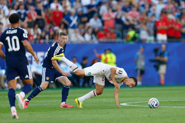 June 19, 2026; Foxborough, Massachusetts, USA; Morocco midfielder Bilal El Khannouss (23) gets tripped up by Scotland midfielder Lewis Ferguson (19) during a FIFA World Cup, WM, Weltmeisterschaft, Fussball 2026 Group C match between Scotland and Morocco at Boston Stadium. (c) CSM FIFA World Cup 2026: Scotland Vs Morocco JUN 19  - ZUMAc04_ 20260619_zma_c04_058 Copyright: xBurtxGranofskyx