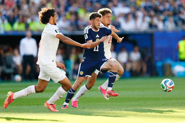 June 19, 2026; Foxborough, Massachusetts, USA; Scotland midfielder Ryan Christie (11) tries to get to the ball ahead of Morocco midfielder Neil El Aynaoui (24) and Morocco midfielder Ayyoub Bouaddi (6) during a FIFA World Cup, WM, Weltmeisterschaft, Fussball 2026 Group C match between Scotland and Morocco at Boston Stadium. (c) CSM FIFA World Cup 2026: Scotland Vs Morocco JUN 19  - ZUMAc04_ 20260619_zma_c04_061 Copyright: xBurtxGranofskyx