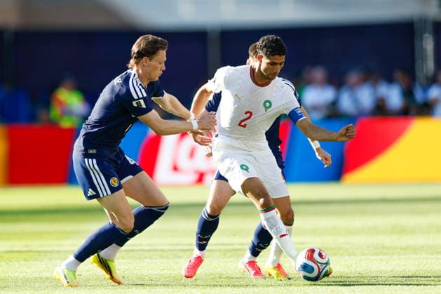 June 19, 2026; Foxborough, Massachusetts, USA; Scotland midfielder Scott McTominay (4) tries to contain Morocco defender Achraf Hakimi (2) during a FIFA World Cup, WM, Weltmeisterschaft, Fussball 2026 Group C match between Scotland and Morocco at Boston Stadium. (c) CSM - ZUMAc04_ 20260619_zma_c04_052 Copyright: xBurtxGranofskyx