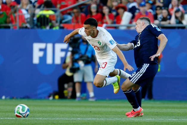 FOXBOROUGH, MA - JUNE 19: Bilal El Khannouss 23 of Morocco tripped up by Lewis Ferguson 19 of Scotland during a FIFA World Cup, WM, Weltmeisterschaft, Fussball 2026 Group C match between Scotland and Morocco on June 19, 2026 at Boston Stadium in Foxborough, Massachusetts. (Photo by Fred Kfoury III Icon Sportswire) SOCCER: JUN 19 FIFA World Cup 26 Group C - Scotland vs Morocco EDITORIAL USE ONLY Icon482260619010