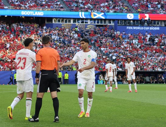 June 19, 2026, Foxborough, Massachusetts, USA: Morocco defender Achraf Hakimi (2) and Morocco midfielder Bilal El Khannouss (23) talk to an official during the June 19th FIFA World Cup, WM, Weltmeisterschaft, Fussball 2026 matchup between Scotland and Morocco at Gillette Stadium in Foxborough, Massachusetts. Foxborough USA - ZUMAs325 20260619_zsp_s325_185 Copyright: xJessxStilesx