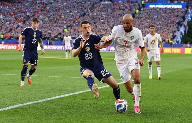 Kenny McLean of Scotland and Noussair Mazraoui of Morocco Scotland v Morocco, 2026 FIFA World Cup, WM, Weltmeisterschaft, Fussball Group C, Football, Boston Stadium, Foxborough, Massachusetts, USA - 19 Jun 2026Foxborough Boston Stadium Massachusetts (MA) United States of America EDITORIAL USE ONLY No use with unauthorised audio, video, data, fixture lists, club league logos or live services. Online in-match use limited to 120 images, no video emulation. No use in betting, games or single club league player publications.  Copyright: xMichaelxZemanek Shutterstockx 16928953fy