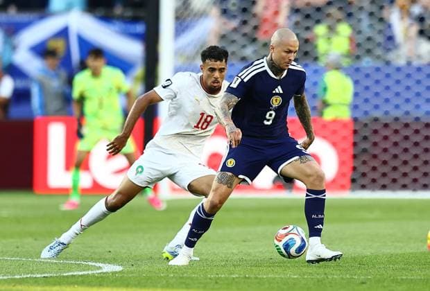 Lyndon Dykes of Scotland and Chadi Riad of Morocco Scotland v Morocco, 2026 FIFA World Cup, WM, Weltmeisterschaft, Fussball Group C, Football, Boston Stadium, Foxborough, Massachusetts, USA - 19 Jun 2026Foxborough Boston Stadium Massachusetts (MA) United States of America EDITORIAL USE ONLY No use with unauthorised audio, video, data, fixture lists, club league logos or live services. Online in-match use limited to 120 images, no video emulation. No use in betting, games or single club league player publications.  Copyright: xMichaelxZemanek Shutterstockx 16928953fz