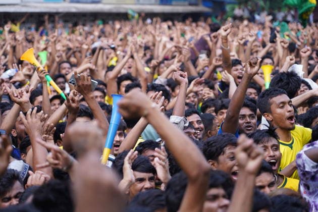 June 20, 2026, Dhaka, Dhaka, Bangladesh: Dhaka, Bangladesh, June 20, 2026: Football fans gather at the Teacher-Student Centre (TSC) of the University of Dhaka to watch the FIFA World Cup, WM, Weltmeisterschaft, Fussball match between Brazil and Haiti on a giant screen in Dhaka, Bangladesh. Thousands of supporters wearing Brazil s yellow and green colors cheered, waved flags, and celebrated throughout the match, creating a festive atmosphere at the venue. Following the game, jubilant fans took part in celebrations and victory processions, reflecting the enduring passion for football among Bangladeshi supporters. Dhaka Bangladesh - ZUMAk185 0859594250st Copyright: xRubelxKarmakerx