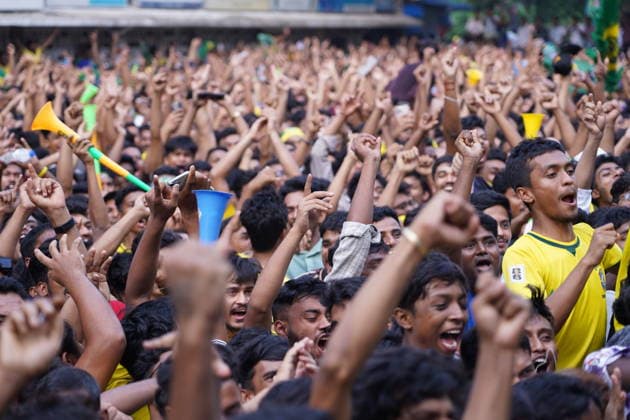 June 20, 2026, Dhaka, Dhaka, Bangladesh: Dhaka, Bangladesh, June 20, 2026: Football fans gather at the Teacher-Student Centre (TSC) of the University of Dhaka to watch the FIFA World Cup, WM, Weltmeisterschaft, Fussball match between Brazil and Haiti on a giant screen in Dhaka, Bangladesh. Thousands of supporters wearing Brazil s yellow and green colors cheered, waved flags, and celebrated throughout the match, creating a festive atmosphere at the venue. Following the game, jubilant fans took part in celebrations and victory processions, reflecting the enduring passion for football among Bangladeshi supporters. Dhaka Bangladesh - ZUMAk185 0859594258st Copyright: xRubelxKarmakerx
